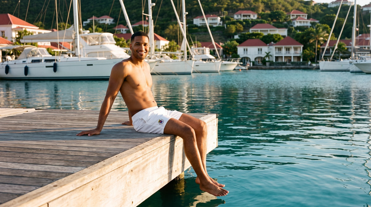 AI-generated scene: model wearing Saint Barthélemy Swim Trunks – White Crest at Gustavia Harbor, Saint Barthélemy